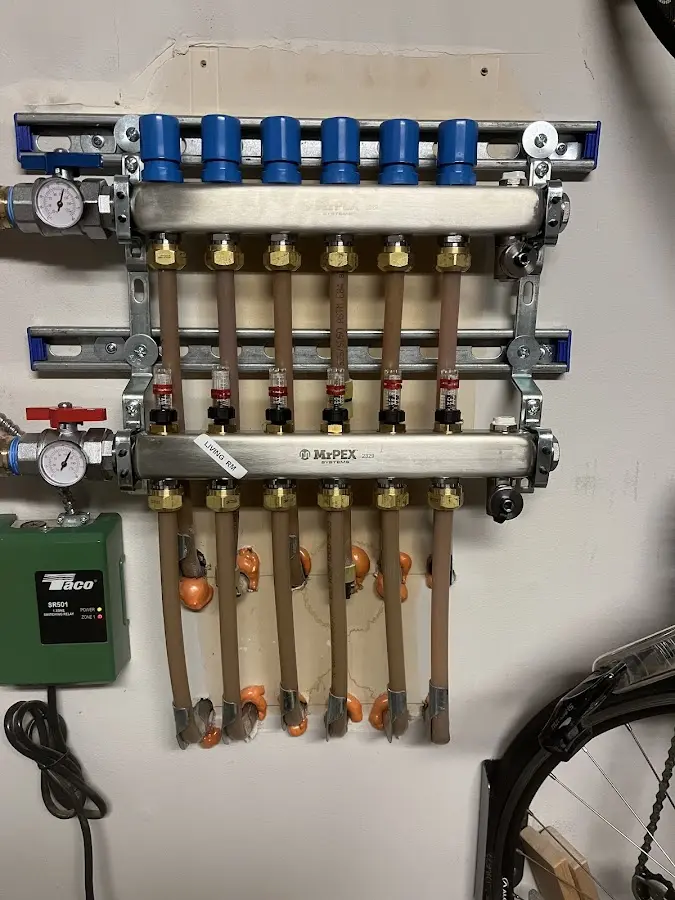 Plumber performing Water Heater Repair at a residential property in Bethel Park